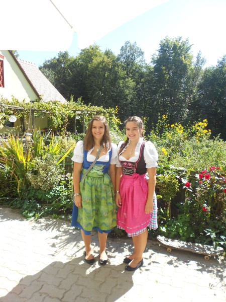 2 women in traditional dresses 