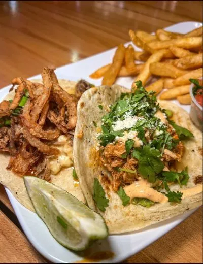 a close up of a plate of fresh tacos