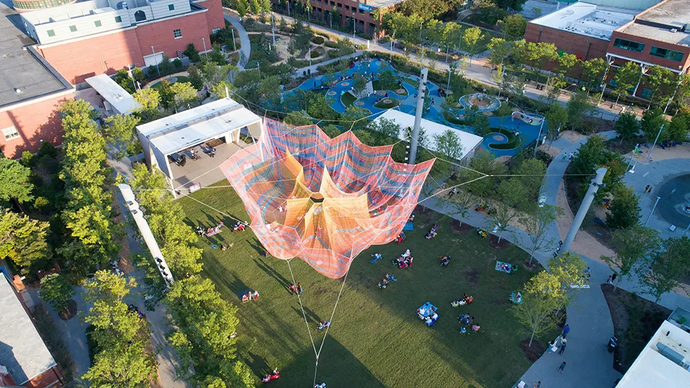 A colorful hanging net sculpture